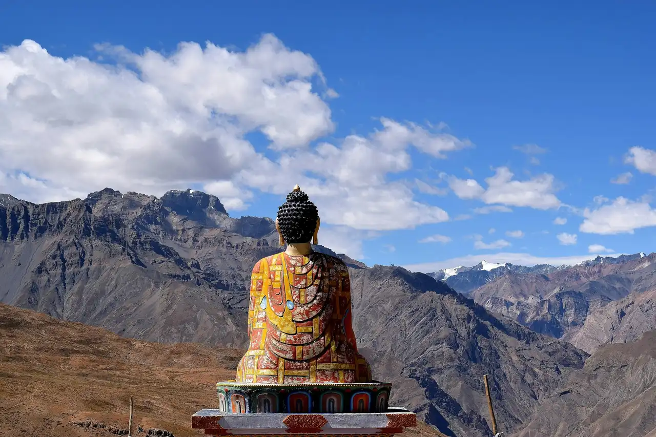 The colourful seated Buddha statue at Langza facing the Spiti mountains